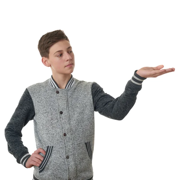 Carino adolescente ragazzo in grigio maglione su bianco isolato sfondo — Foto Stock