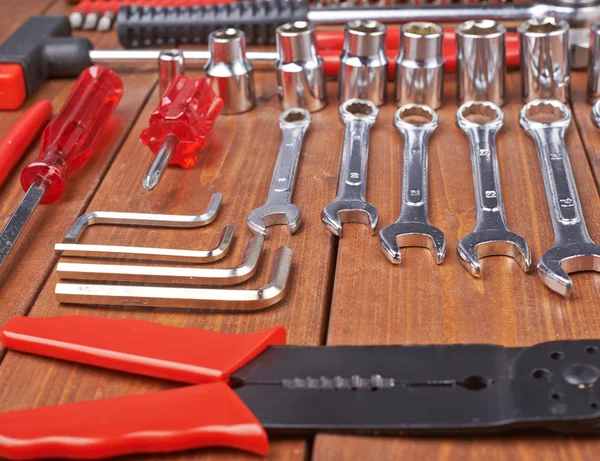 Set of different work tools on wooden surface — Stock Photo, Image