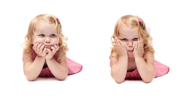 Junges kleines Mädchen auf isoliertem weißen Hintergrund liegend — Stockfoto