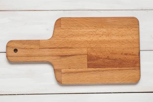 Cutting board on wooden white — Stock Photo, Image