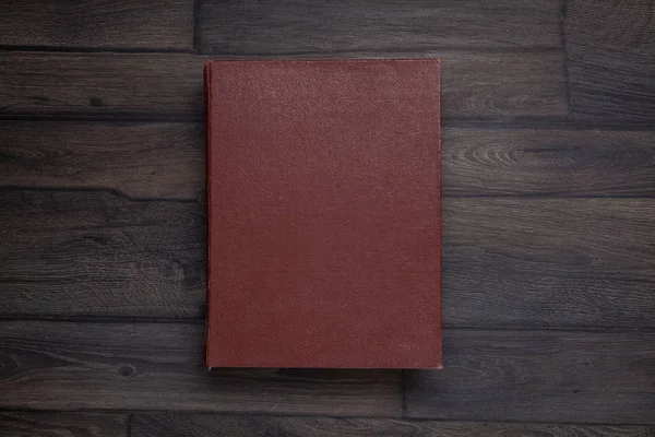 Boek, bovenaanzicht op houten — Stockfoto