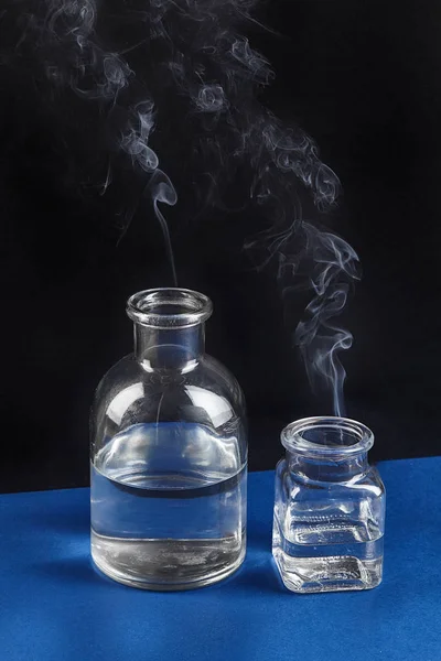 Transparent flask. Smoke. Experiment. Chemistry. For your design.