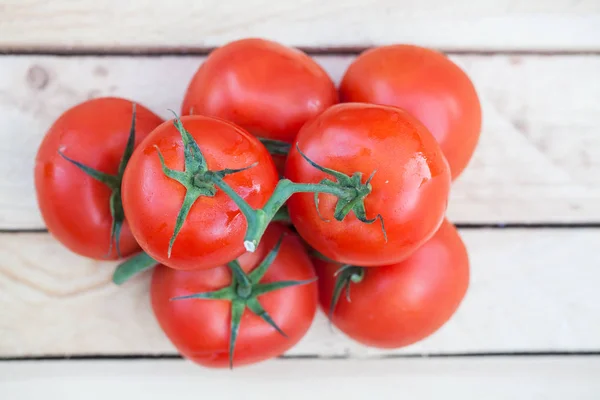 Tomato on wood background — Stock Photo, Image