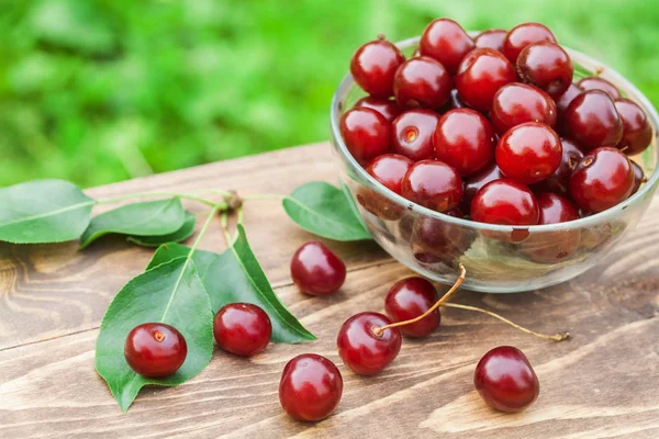Cherry on green natural background — Stock Photo, Image