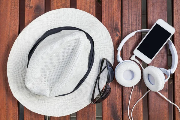 smartphone white headphone on wood