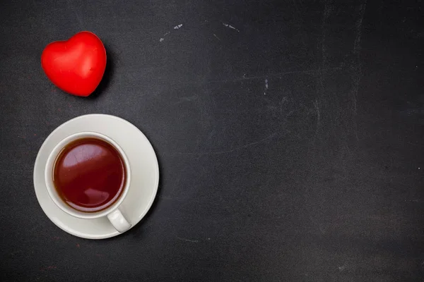 Taza de té en la superficie negra . —  Fotos de Stock