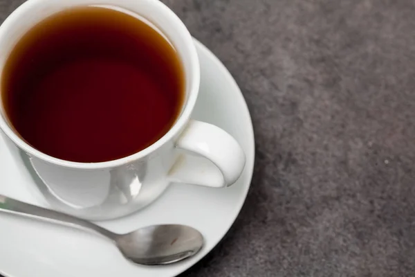 Taza de té fondo negro — Foto de Stock