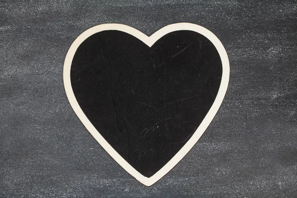 Heart on black board — Stock Photo, Image