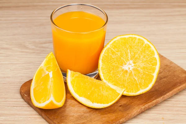 Orange fruit wood chopping board — Stock Photo, Image