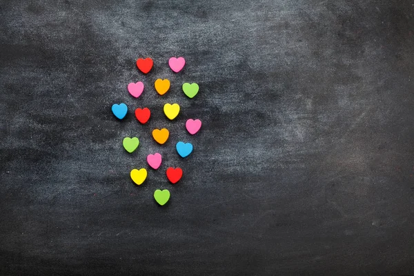 Color heart on black board — Stock Photo, Image