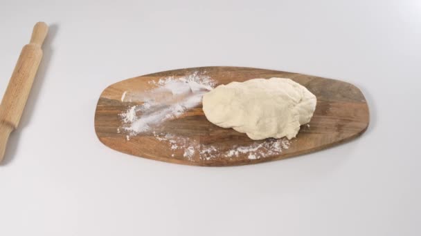 Top view of chef on white table slicing dough into pieces. Close up. — Stock Video