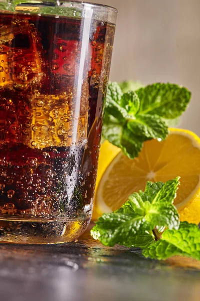 Fresh made Cola, mint and lemon on wooden background. Close up. — Stock Photo, Image