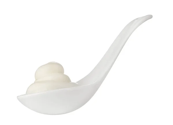 Sour cream in white spoon isolated on background. Close up. — Stock Photo, Image