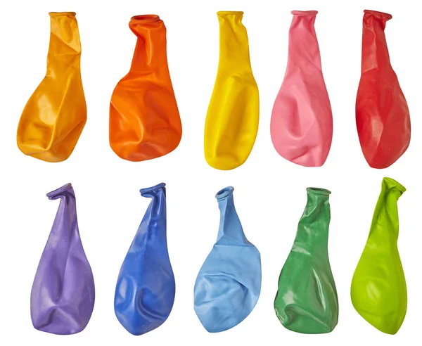 Colorful set deflated balloons isolated on white background. Close up.