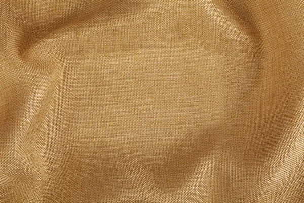 Golden fabric textile with copy space. Abstract Texture. Close up. — Stock Photo, Image