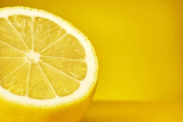 Lemon on yellow background. Copy space. Close up. — Stock Photo, Image