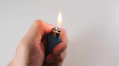 Slow Motion Video of Using a Lighter. Close up hand and object.