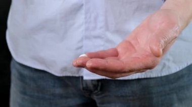 Mans hands pouring shaving cream on hands ready to apply on face and shave. Close up.