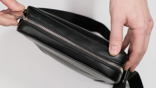 Black leather wallet in a man handbag. Close up. — Stock video