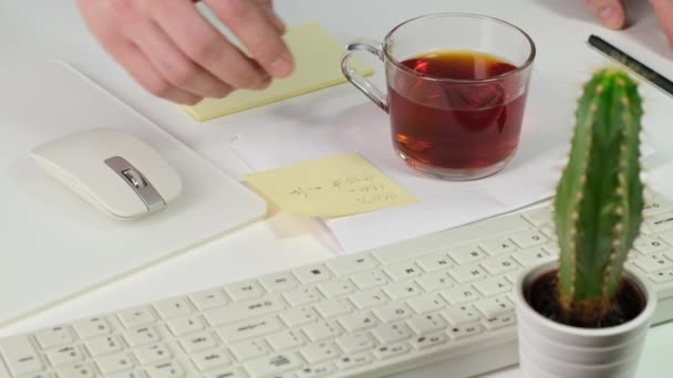 Business woman drink in office on working desk. Close up. — Stock video