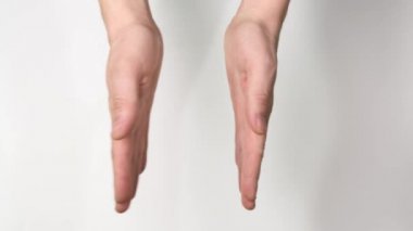 Man clapping with his handson white background. Close up.