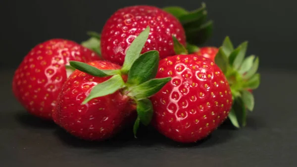 Fresh Strawberry rotating on a black background. Close up. — Stockfoto