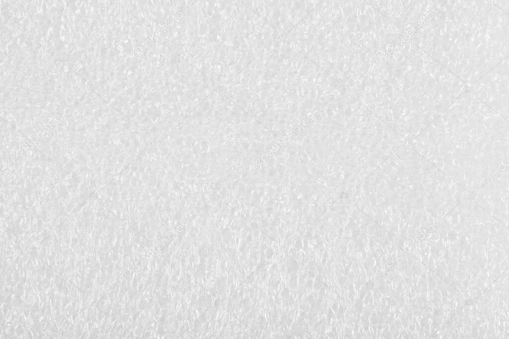 White plastic package background texture close up. Top view.