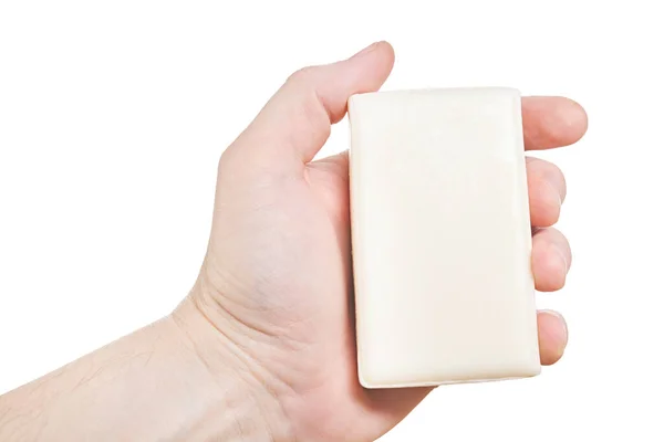 Mão segurando pedaço de sabão cremoso. Isolado sobre fundo branco . — Fotografia de Stock