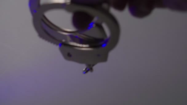 Police handcuffs on white desk close-up — 비디오