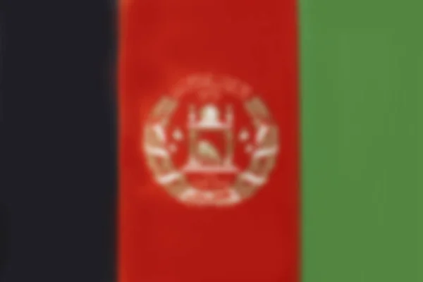 Bandeira do Afeganistão desfocada. Textura ou fundo. Espaço de cópia — Fotografia de Stock