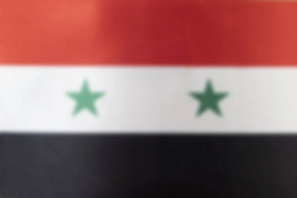 Syriens flagga suddig. Konsistens eller bakgrund. Kopiera utrymme — Stockfoto