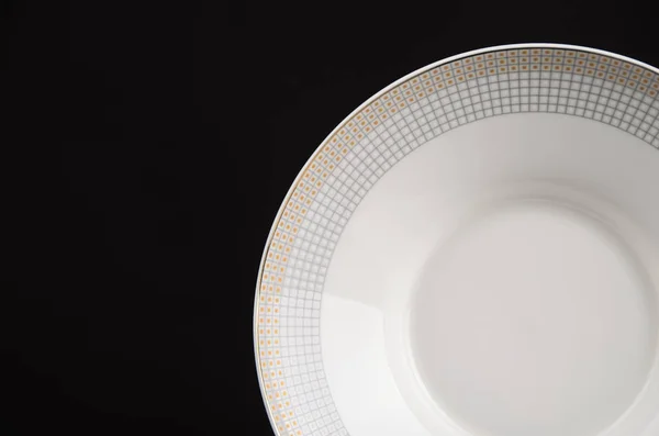 Plate isolated black background — Stock Photo, Image