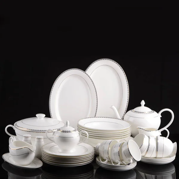 Dinner set empty isolated on black background — Stock Photo, Image