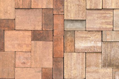 Paving levhaları, dikdörtgen taşları ve farklı renklerdeki kare şekiller, arka plan veya doku olarak ülkedeki yolları donatmak için desenler oluşturulmuştur.