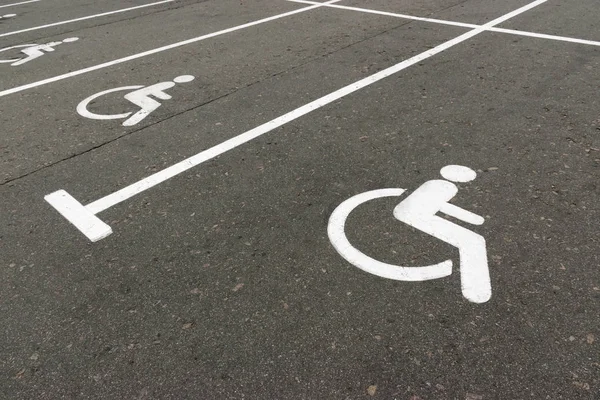 Road marking on the asphalt with parking spaces for the disabled