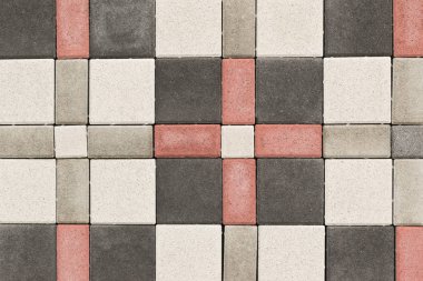 Paving levhaları, dikdörtgen taşları ve farklı renklerdeki kare şekiller, arka plan veya doku olarak ülkedeki yolları donatmak için desenler oluşturulmuştur.