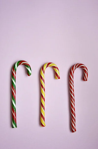 Christmas candy canes. Candy for Christmas and New year, candy sticks in stripes.  Preparation for the holiday. Candy.