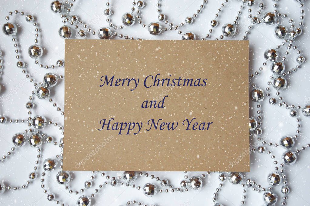 Christmas and New year greeting card. Notepad to write wishes on the background of beads for decoration. Merry Christmas.