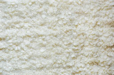 Beyaz yün battaniye. Güzel beyaz bir doku. Örülmüş battaniye.