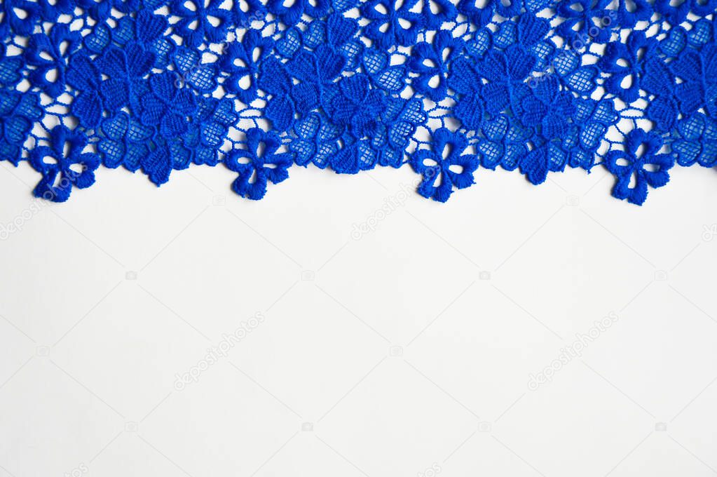 the texture of the fabric. blue openwork pattern. background.