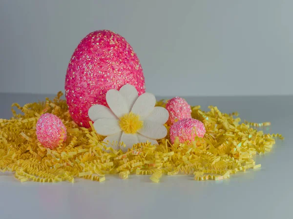 Giant Pink Easter Egg Sitting Bed Yellow Paper Shreds White — Stock Photo, Image