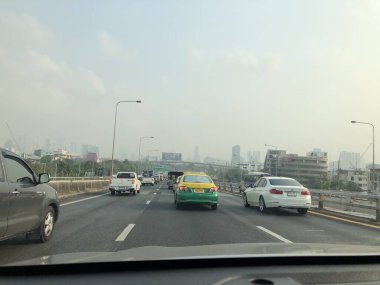 Atmosphere of traffic on road in city