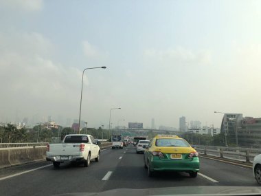 Atmosphere of traffic on road in city