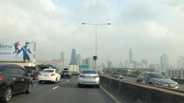 Atmosphere of traffic on road in city
