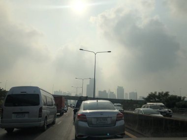 Atmosphere of traffic on road in city
