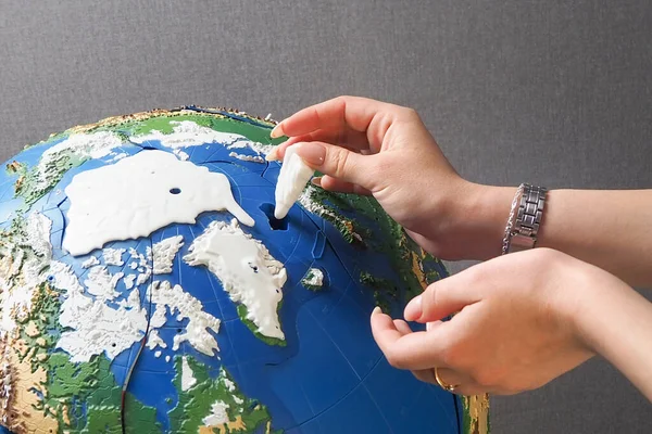 the world is in the hands of man. globe and hands