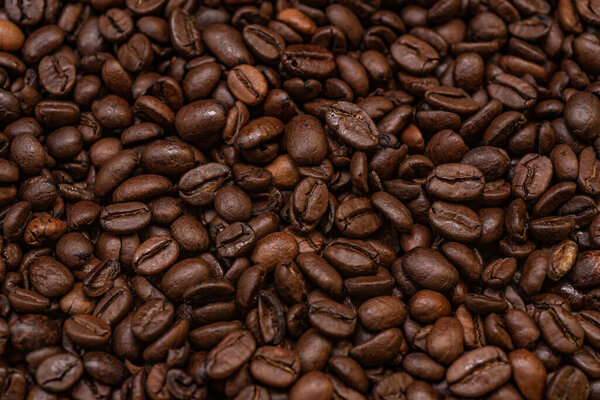 brown coffee beans, top view. texture of coffee beans