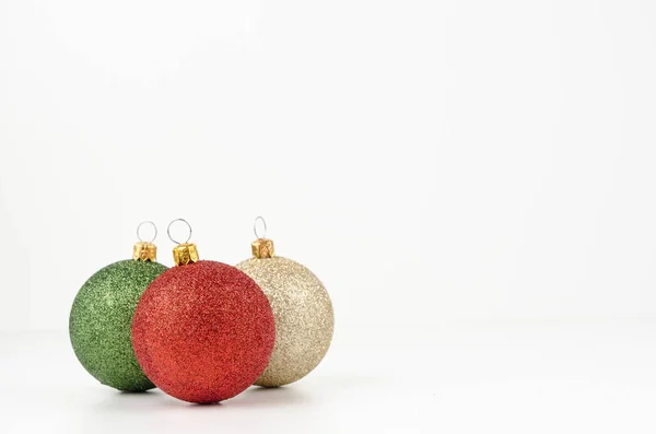 Gold, green and red Christmas balls isolated on white background — Stock Photo, Image