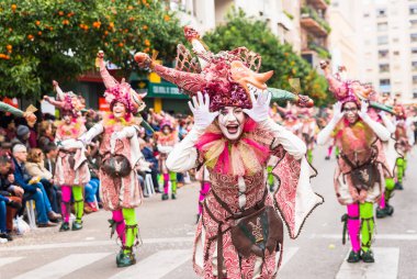 Badajoz, Spain, sunday. February.26. 2017 Participants in colorful costumes take part in the carnival parade in Badajoz 2017 clipart