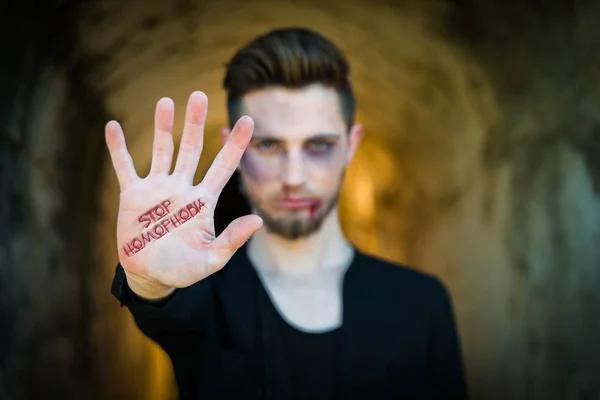 Main avec texte Stop à l'homophobie — Photo